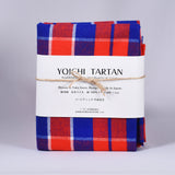 YOICHI Tartan 余市タータン 　播州織タータン生地　ラージチェック片面起毛加工の写真。赤、青、白で起毛のラージチェック生地で、白い帯と麻紐で包装されている。